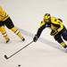Michigan junior defenseman Mac Bennett brings the puck up ice in the game against Michigan Tech at Joe Louis Arena on Saturday, Dec. 29. Daniel Brenner I AnnArbor.com